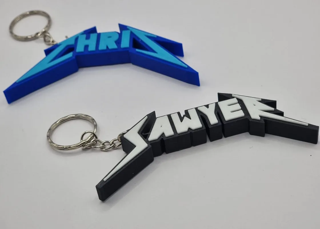 A Quirky Gift Co custom metal band-style keychain, personalised with a name.